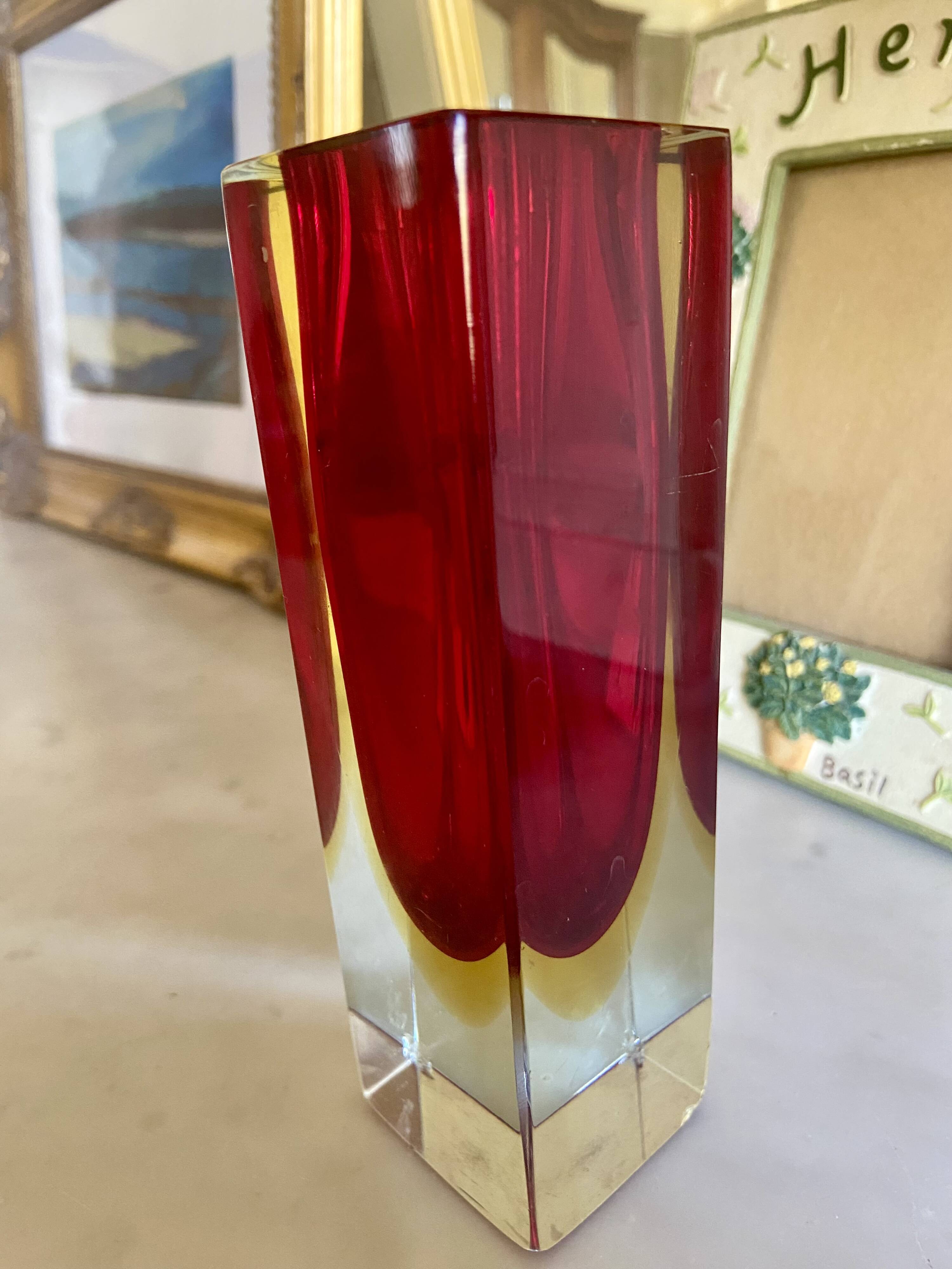 Small red vase made of Murano glass.