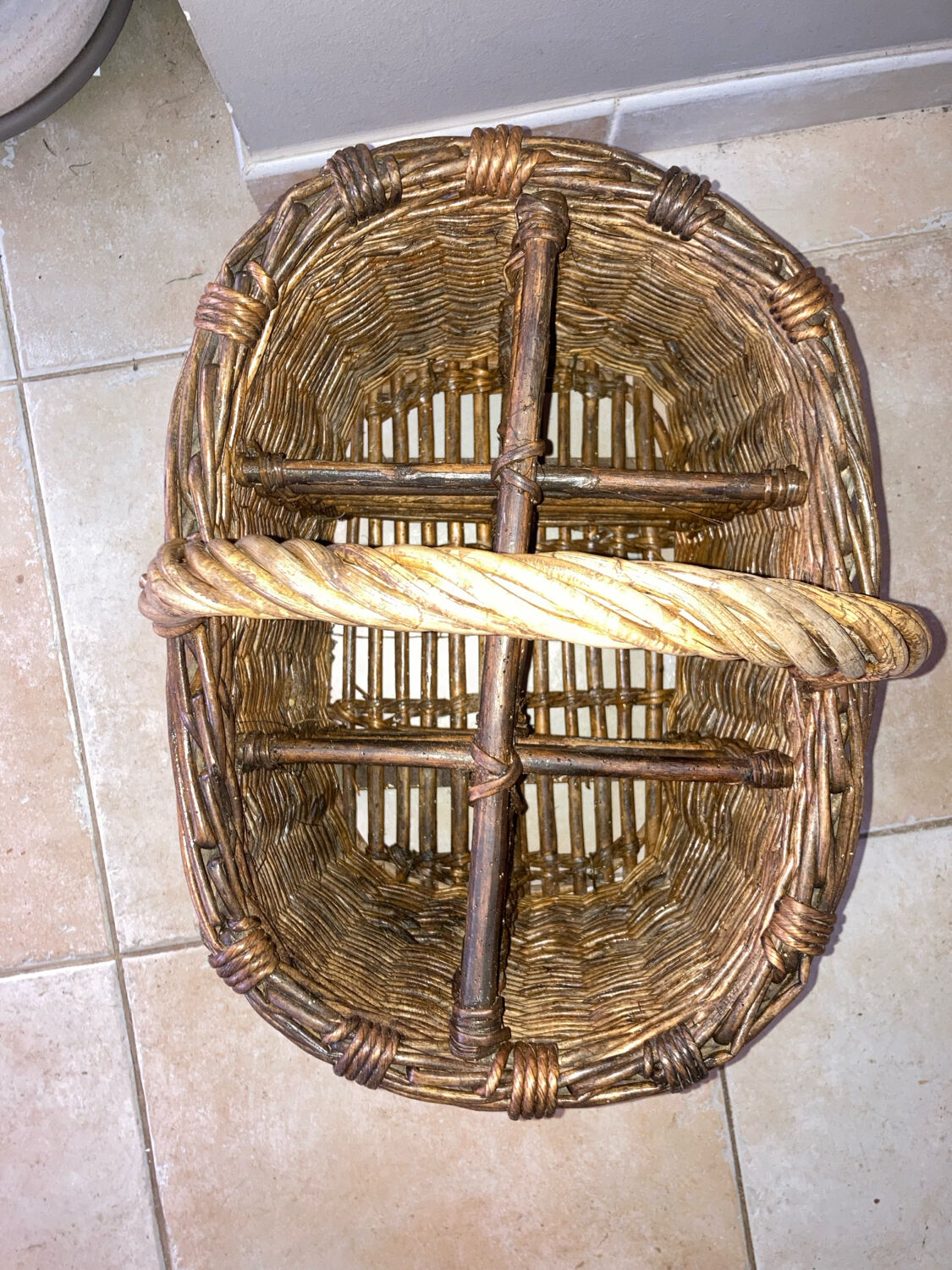 Wicker and hazel bottle basket from the early 20th century or possibly earlier.