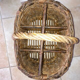 Wicker and hazel bottle basket from the early 20th century or possibly earlier.