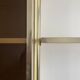 Wall-mounted and modular bookcase in lacquered brass, mirrors and smoked glass by Mahey, Design 1970