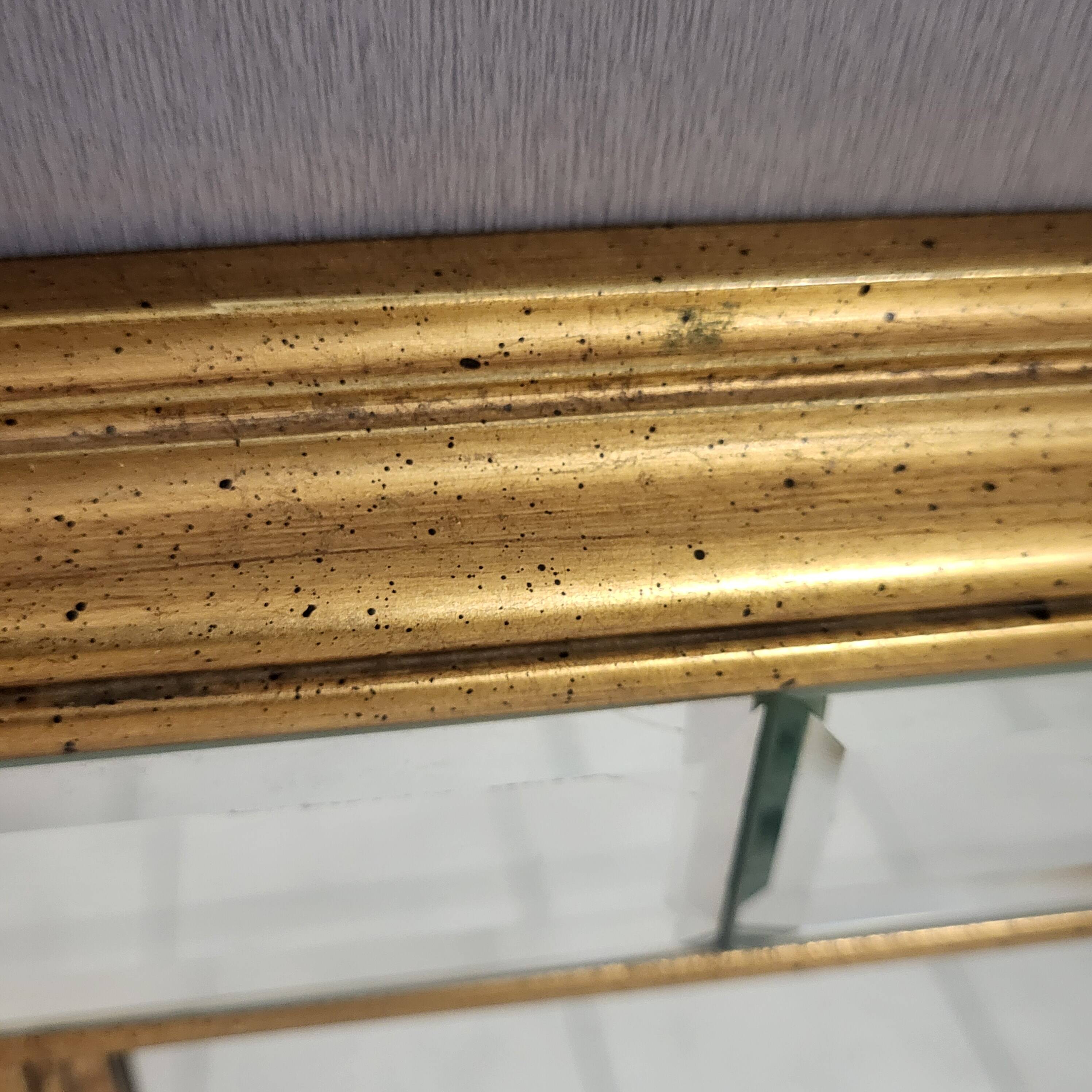 Bevelled and gold mirror with a frame by DeKnudt, Belgium 1960-70.