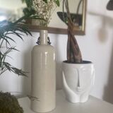 Old enameled stoneware bottle