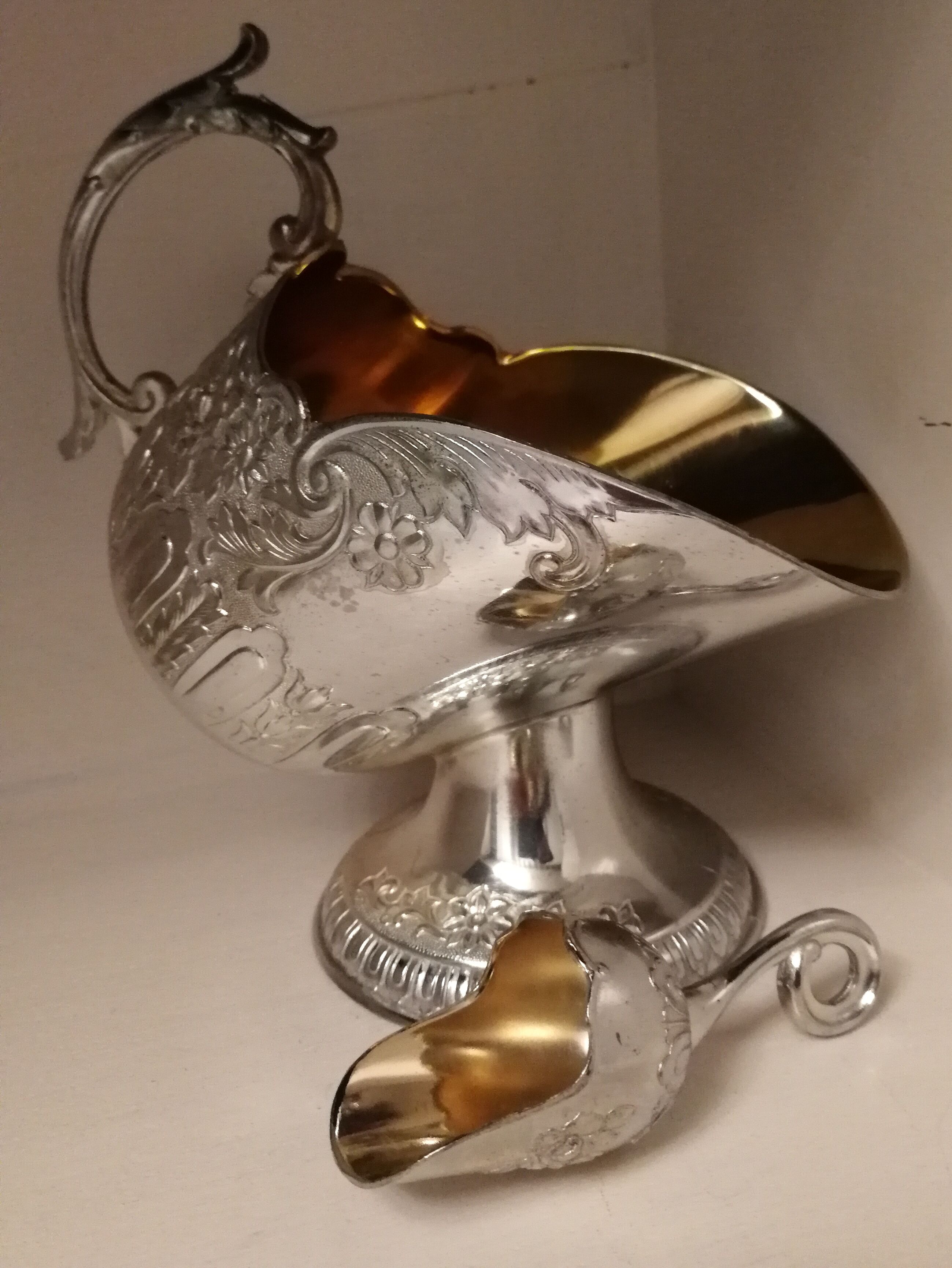Sugar and sugar shovel in golden silver metal