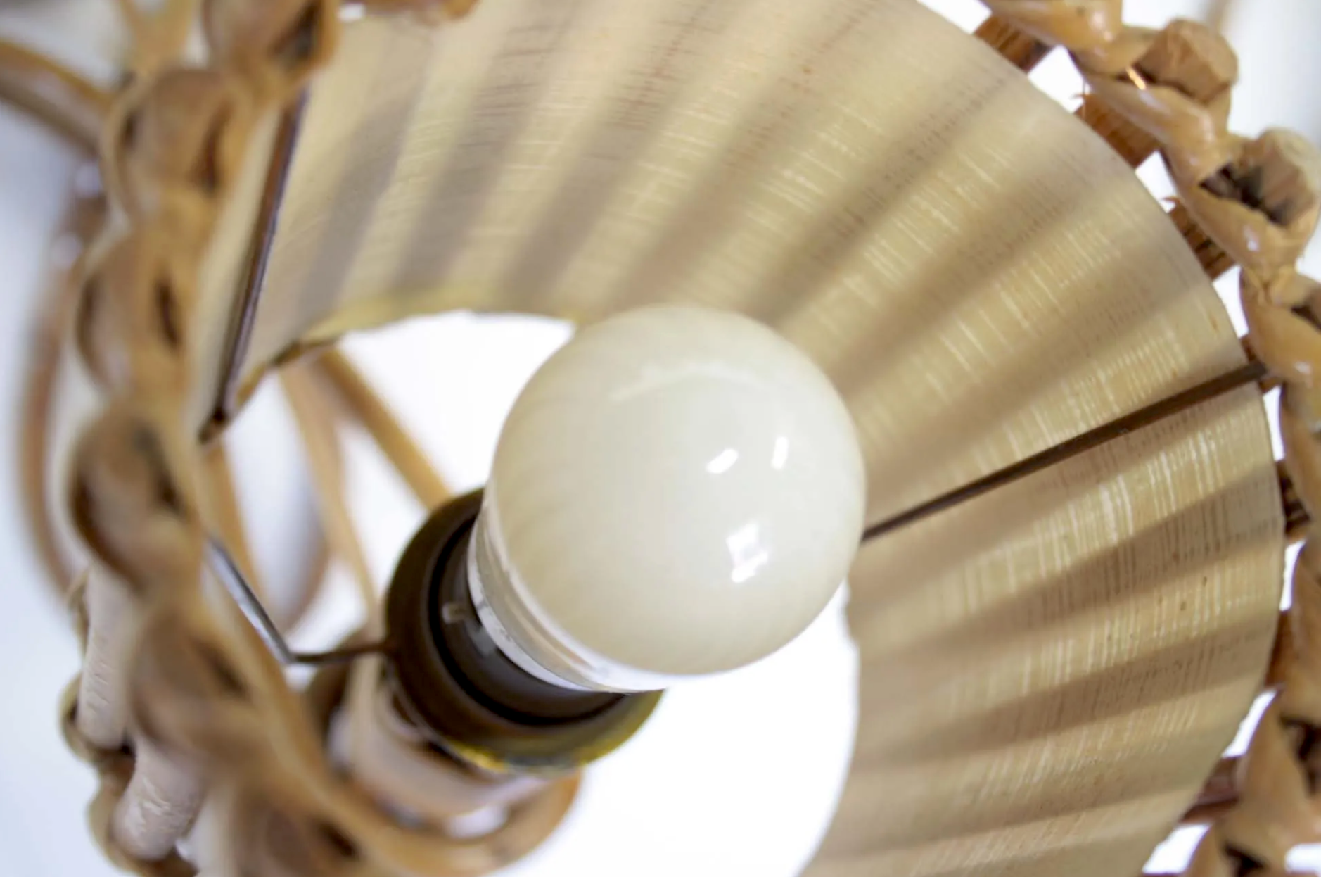 Pair of Louis Sognot rattan sconces