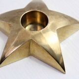 Star-shaped brass candle holder