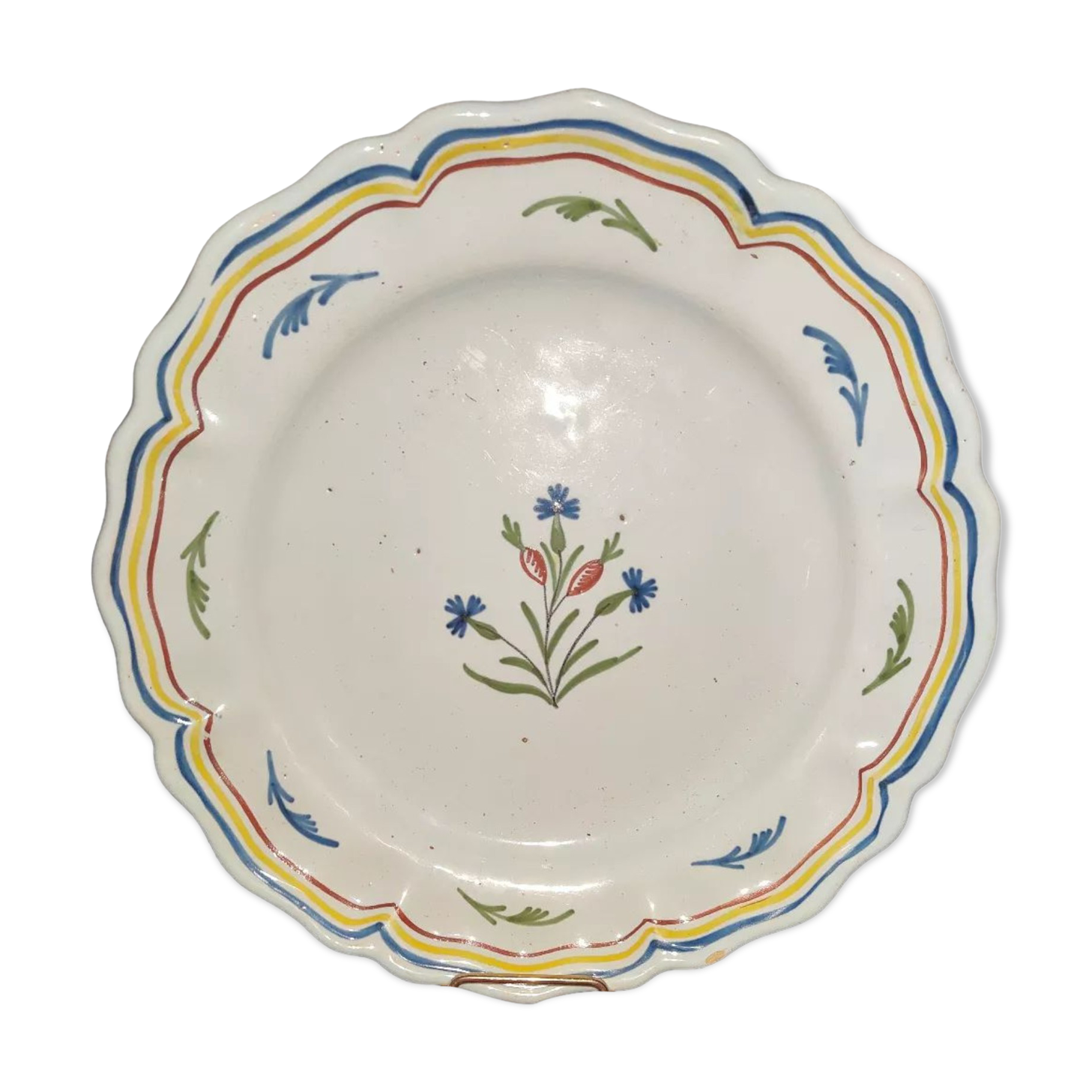 Old plate in earthenware of Nevers eighteenth Century with chantourné edges