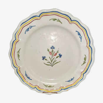 Old plate in earthenware of Nevers eighteenth Century with chantourné edges