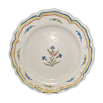 Old plate in earthenware of Nevers eighteenth Century with chantourné edges