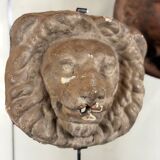 Three cast-iron and terracotta façade decoration lions, around 1880.