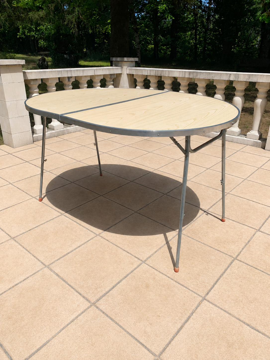 Folding oval table - height adjustable - metal and laminate - 60s/70s.