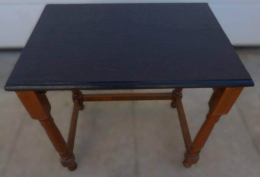 Nightstand or side table in solid wood with a black top.