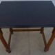 Nightstand or side table in solid wood with a black top.