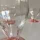 Lot of water in white and pink glass glasses