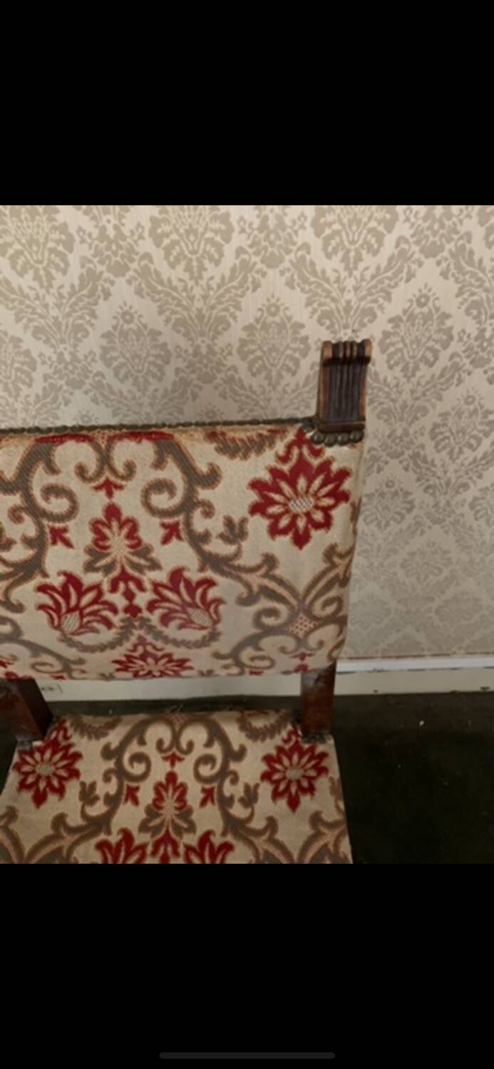 Antique wooden chair with upholstery