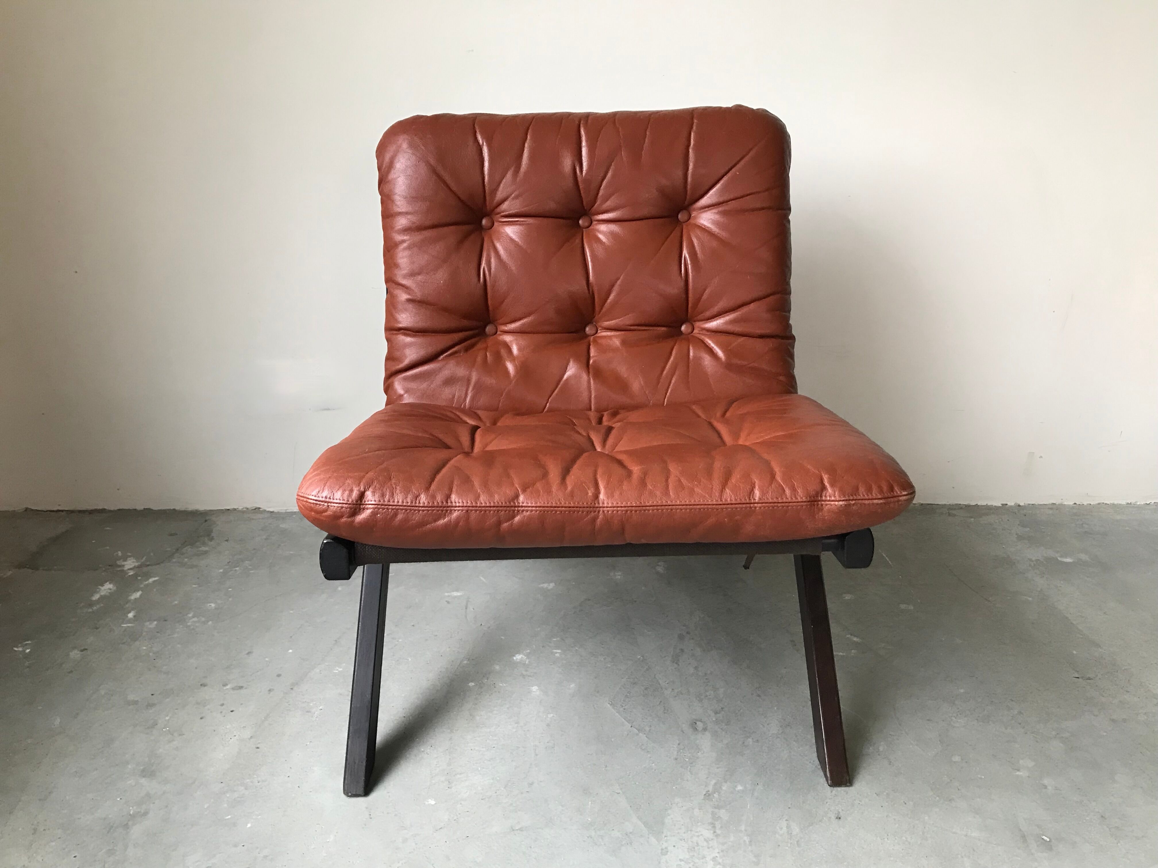 Scandinavian folding armchair in cognac leather