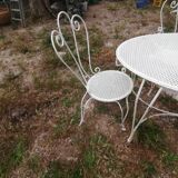 Garden furniture in wrought iron of the 70s. 5 pieces, oval table.
