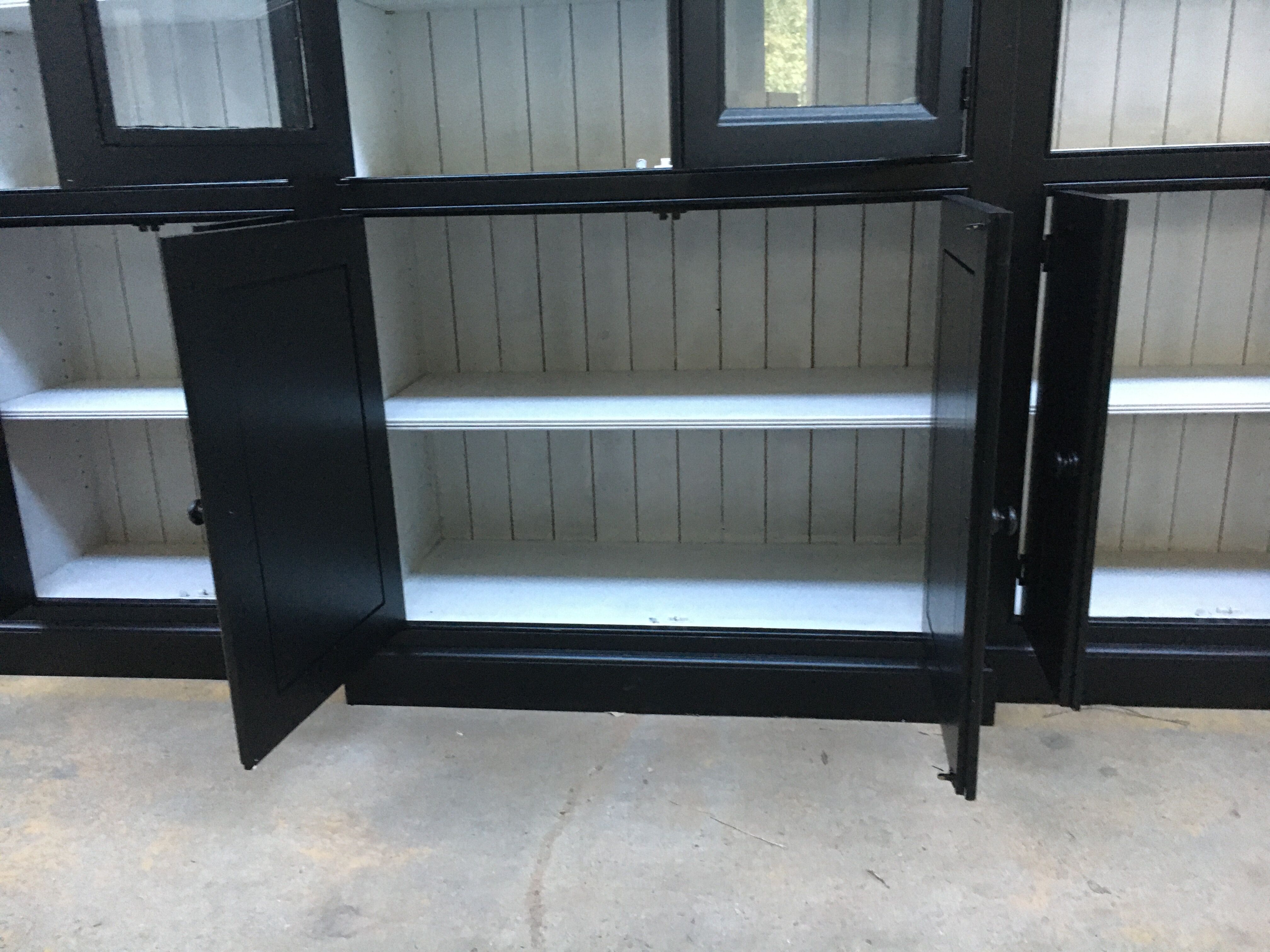 Black patinated wooden bookcase