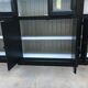 Black patinated wooden bookcase