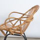 Rattan shell armchair with armrests