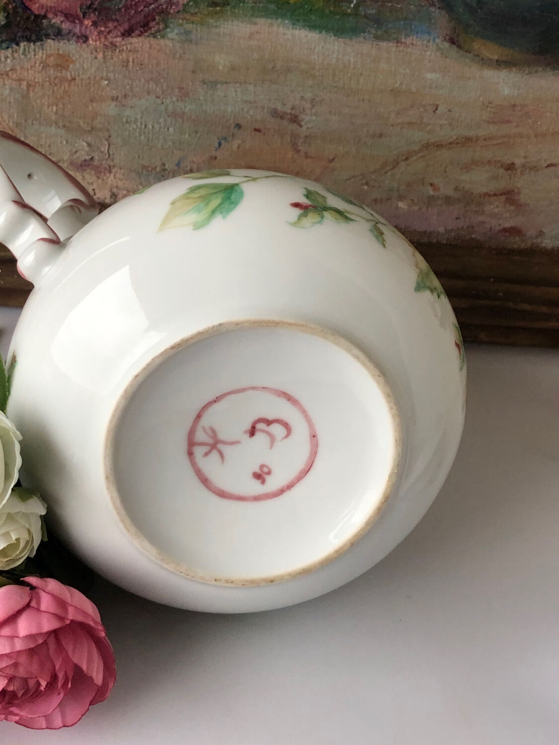 Old white and pink teapot
