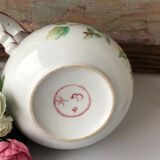 Old white and pink teapot