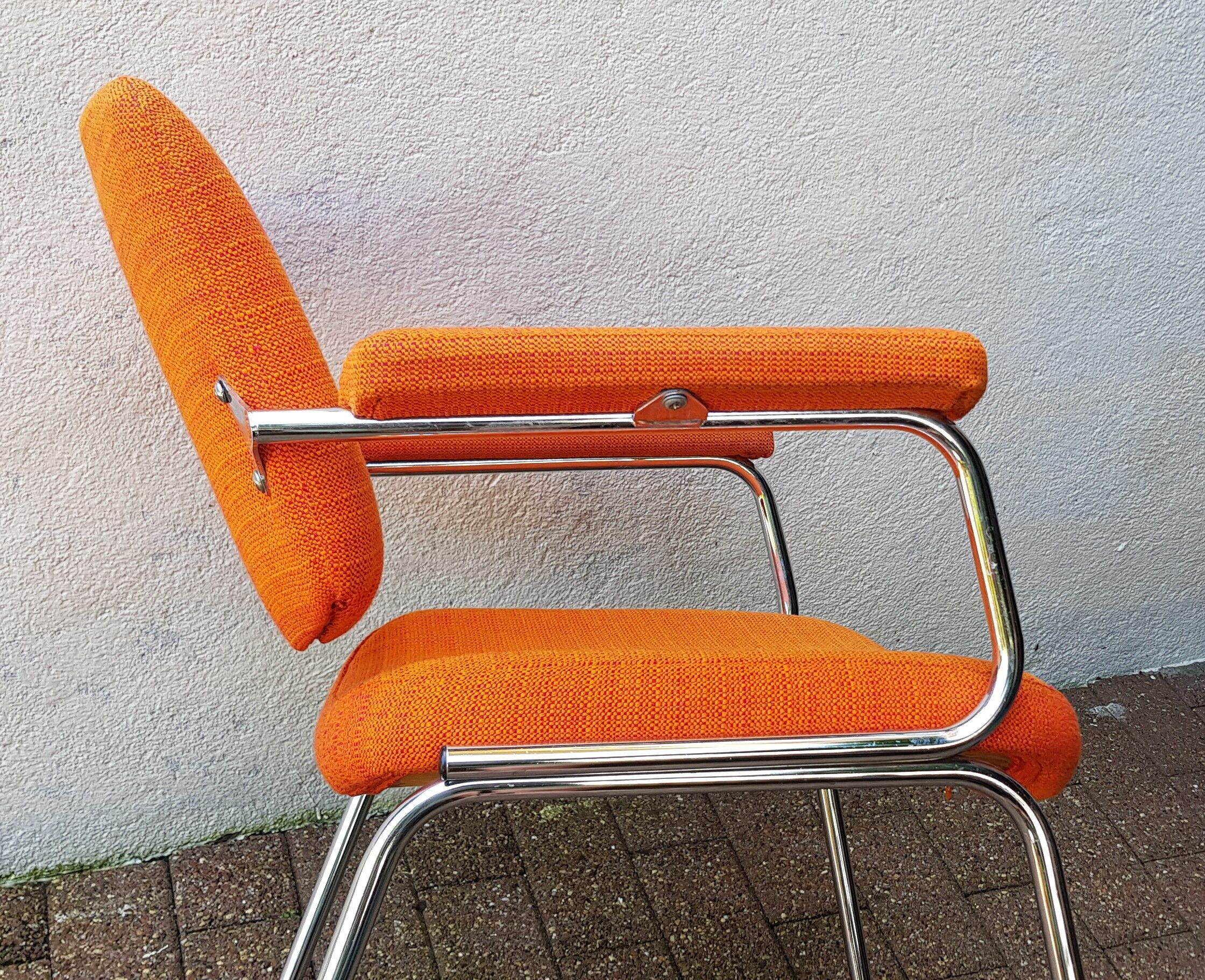 Orange fabrics and chrome armchair 70