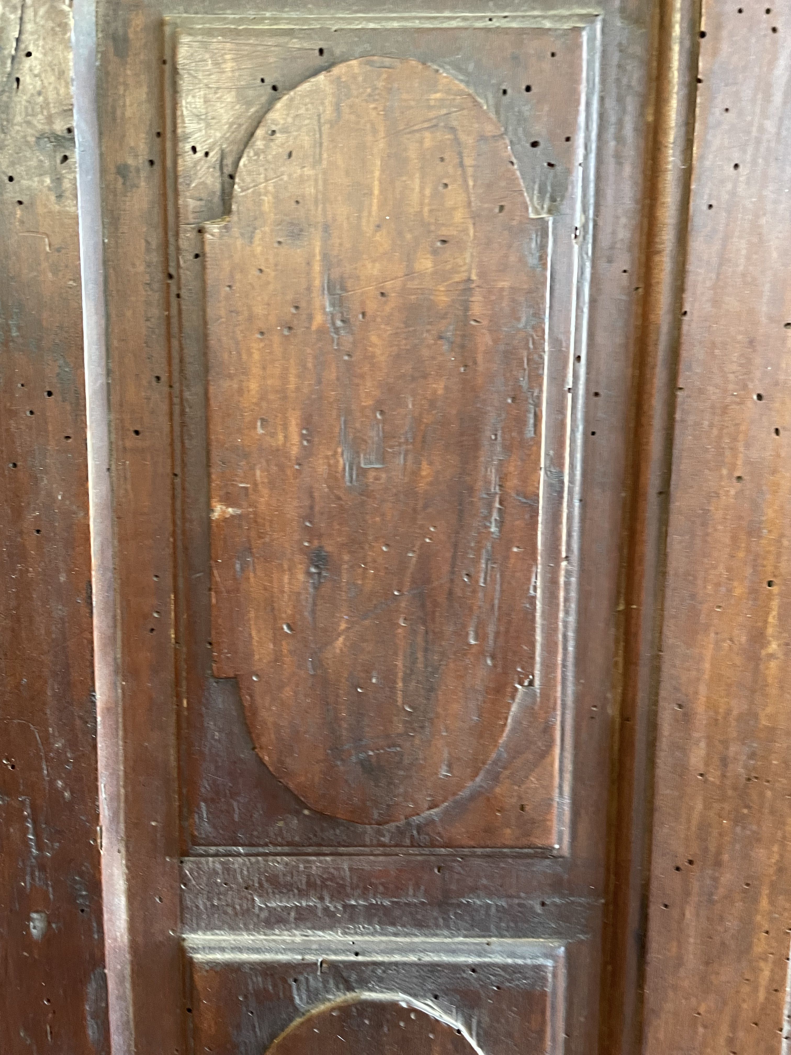 France old 18th century walnut closet door. Composed of 8 finely carved panels.