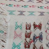 White carpet with multicolored Berber patterns handmade