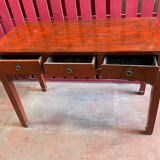 Red lacquer desk, Qing period of the XIXth century, opening to three drawers