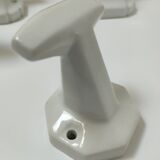 Five art deco white porcelain hooks