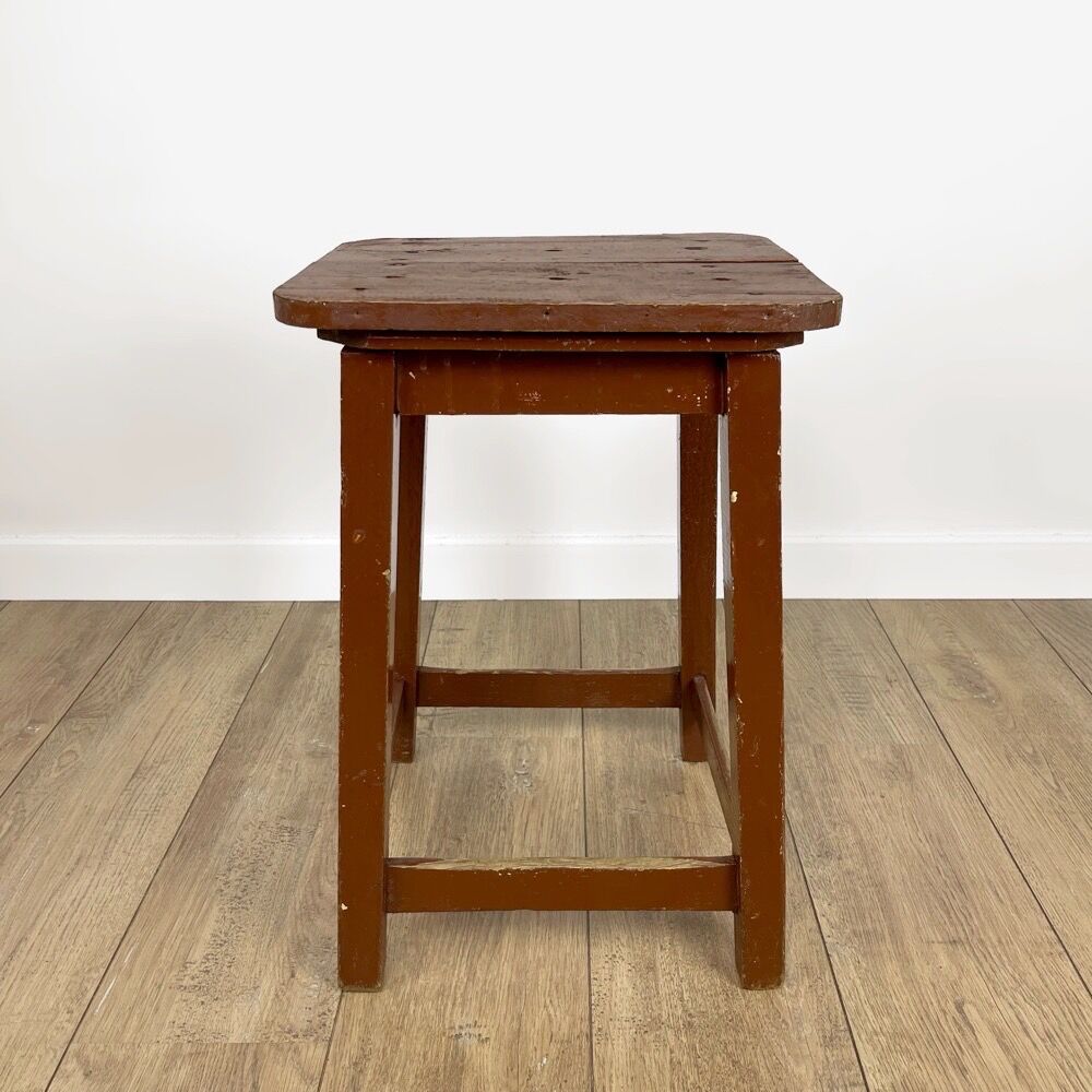 Old solid chocolate wooden stool