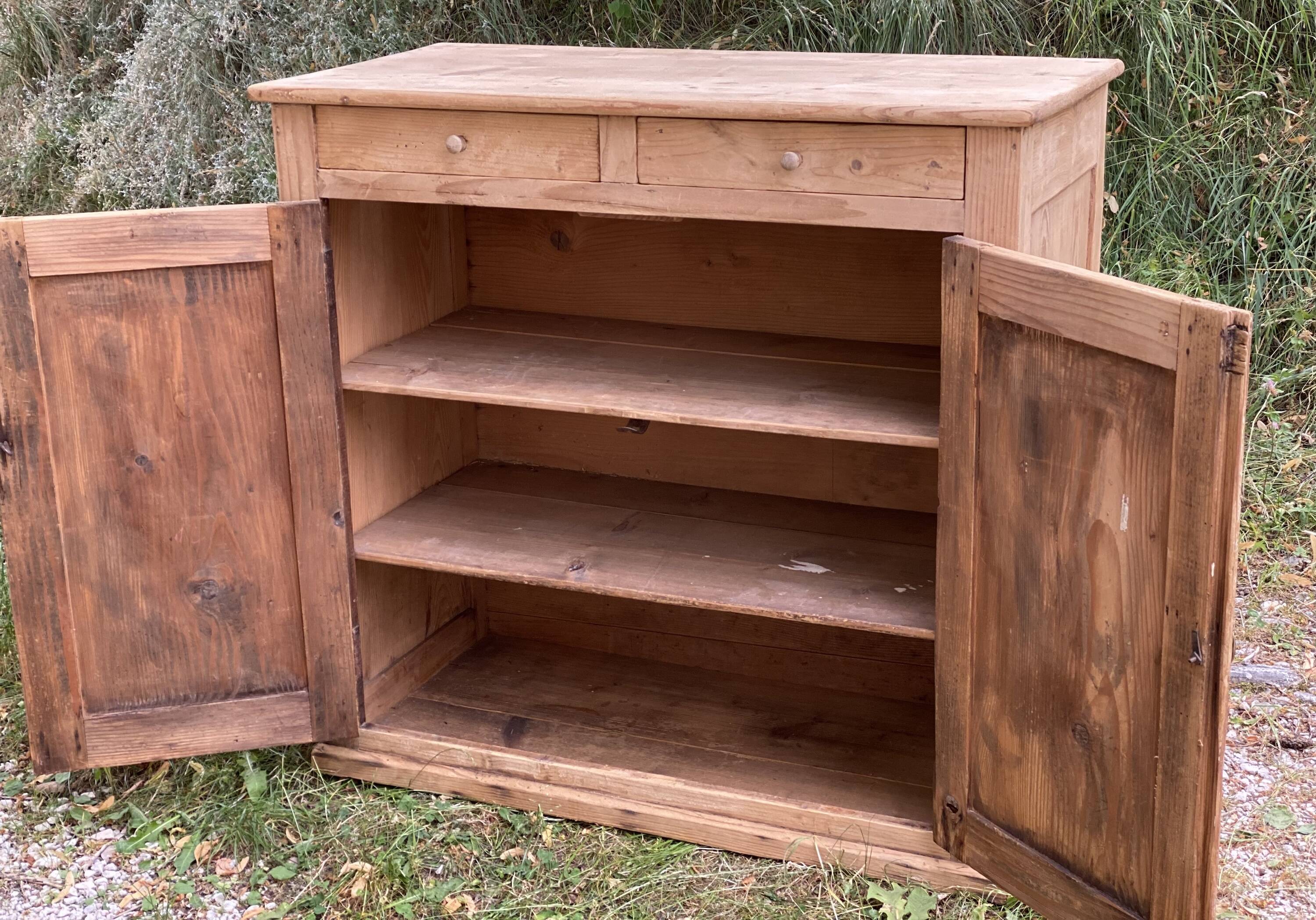 Small Parisian buffet with 2 doors and 2 drawers in light wood.