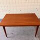 Extendable dining table in teak