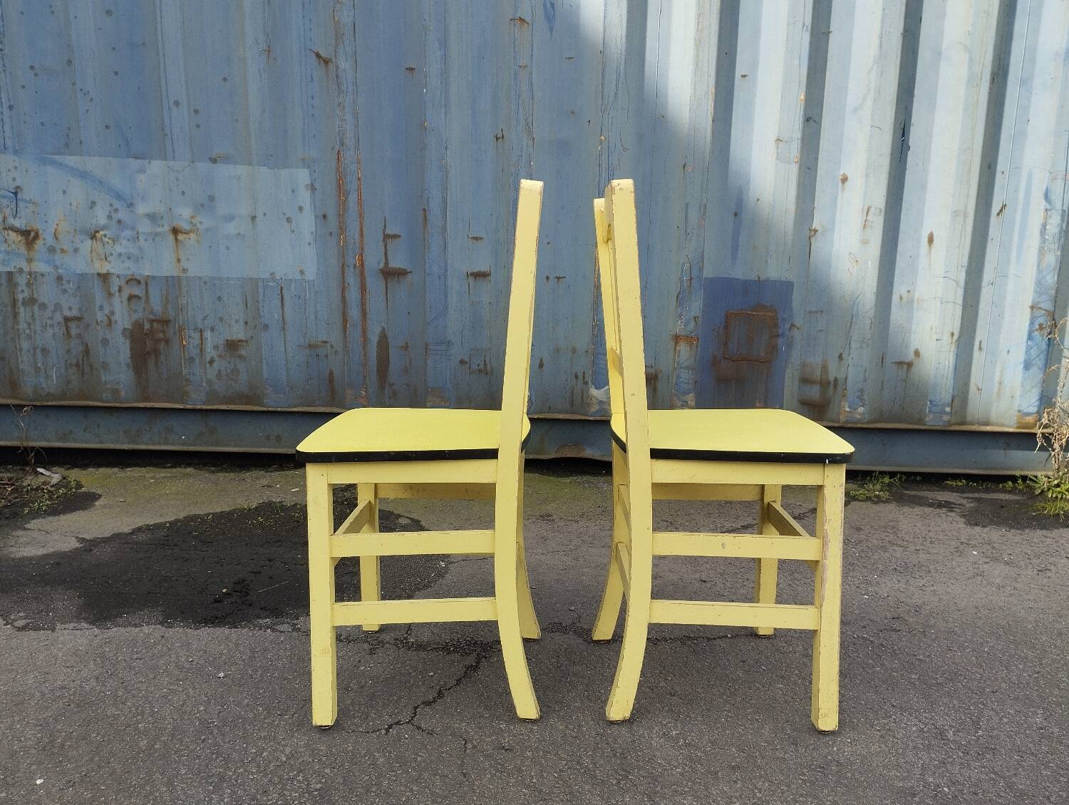 Pair of wooden and yellow formica chairs