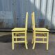 Pair of wooden and yellow formica chairs
