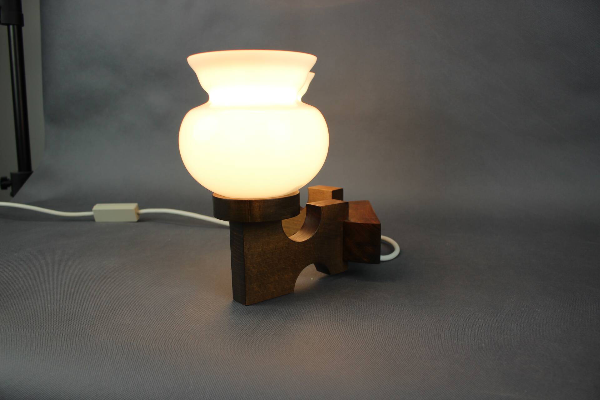 Czechoslovak wall lamp from the 1960s with Valasske Mezirici glass and a wooden base.