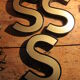 Teaches letter S vintage gold outlined in black format 15 x 21 cm