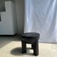 Black mango wood tripod side table with a semi-spherical top, height: 45 cm, diameter: 44 cm.