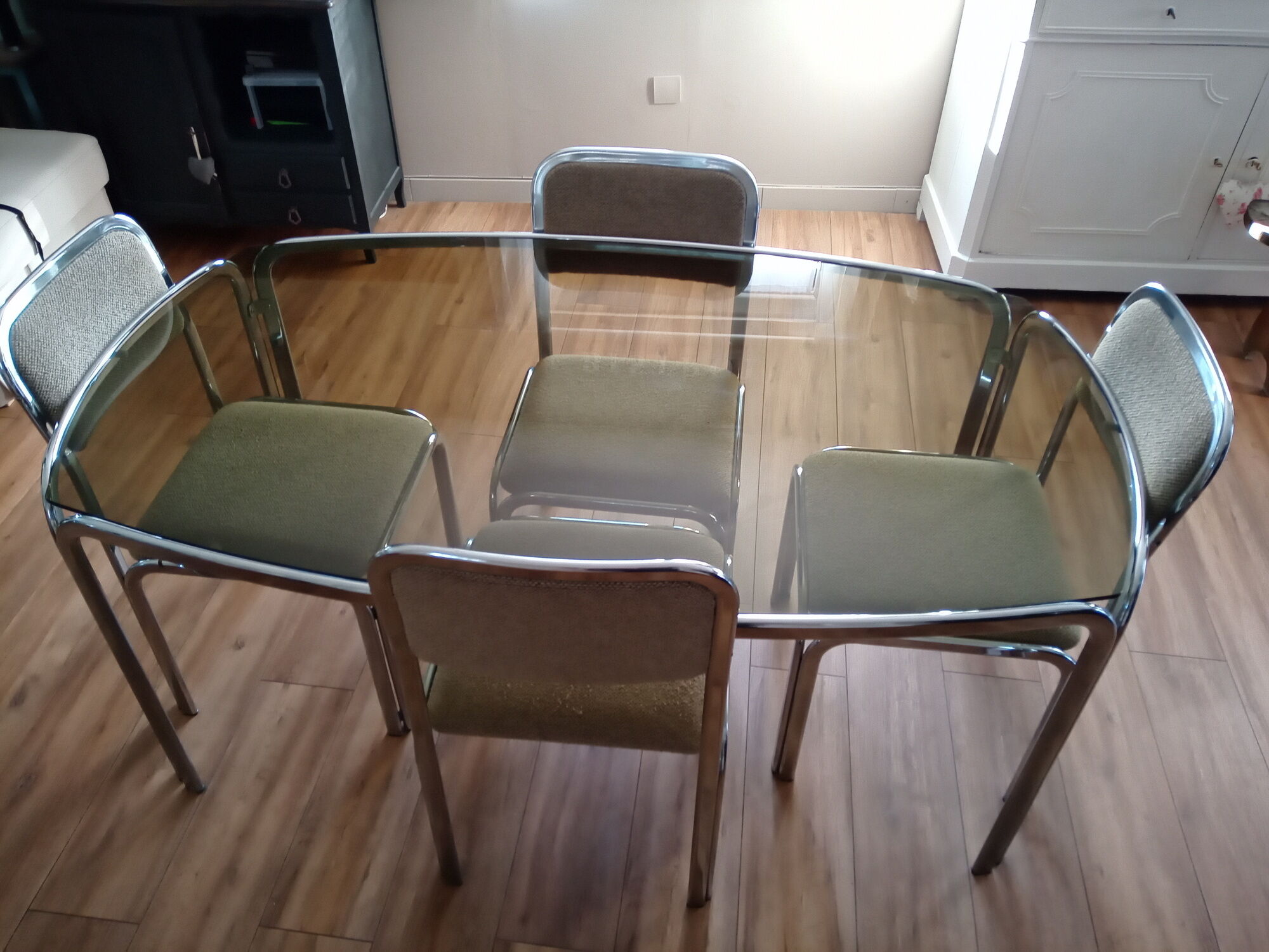 Table and 4 70s chairs chrome base and smoked glass tray chairs green water fabric