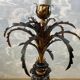 Large pineapple table lamp in carved black and gold wood, France, early 20th century.