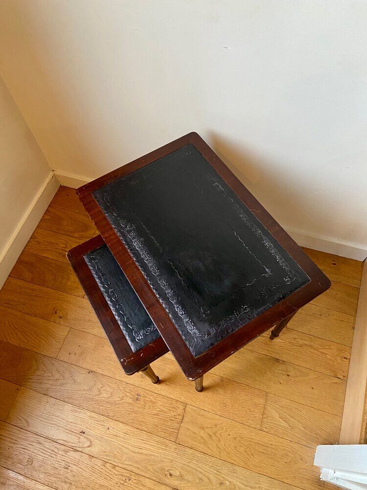 Dark wood and black leather tables