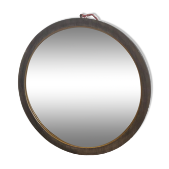 Miroir circulaire en bois mouluré doré et verre biseauté