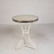 Bistro table with a marble top and brass edging, early 20th century.