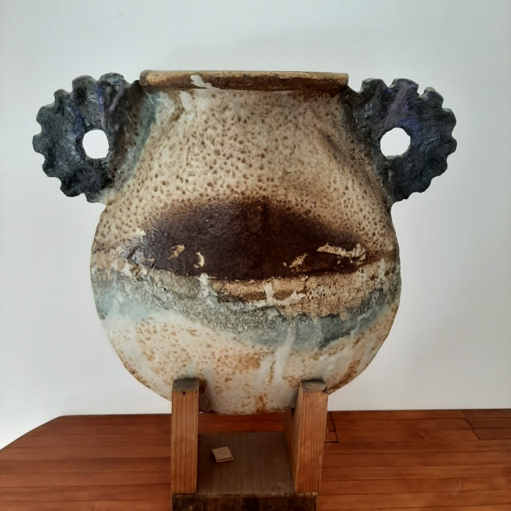 Oval/round pottery on base signed
