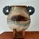 Oval/round pottery on base signed