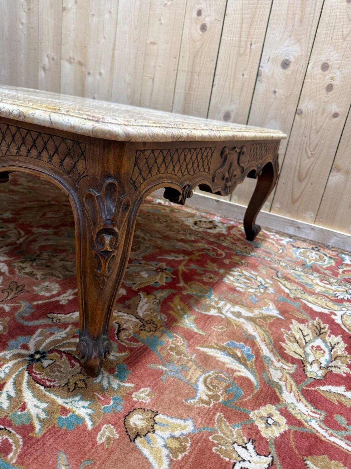 Louis XV style coffee table in walnut with a marble top.