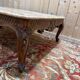 Louis XV style coffee table in walnut with a marble top.