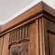Old solid wood wardrobe with three vintage mirror doors