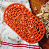 Orange enamelled cast iron oval trivet