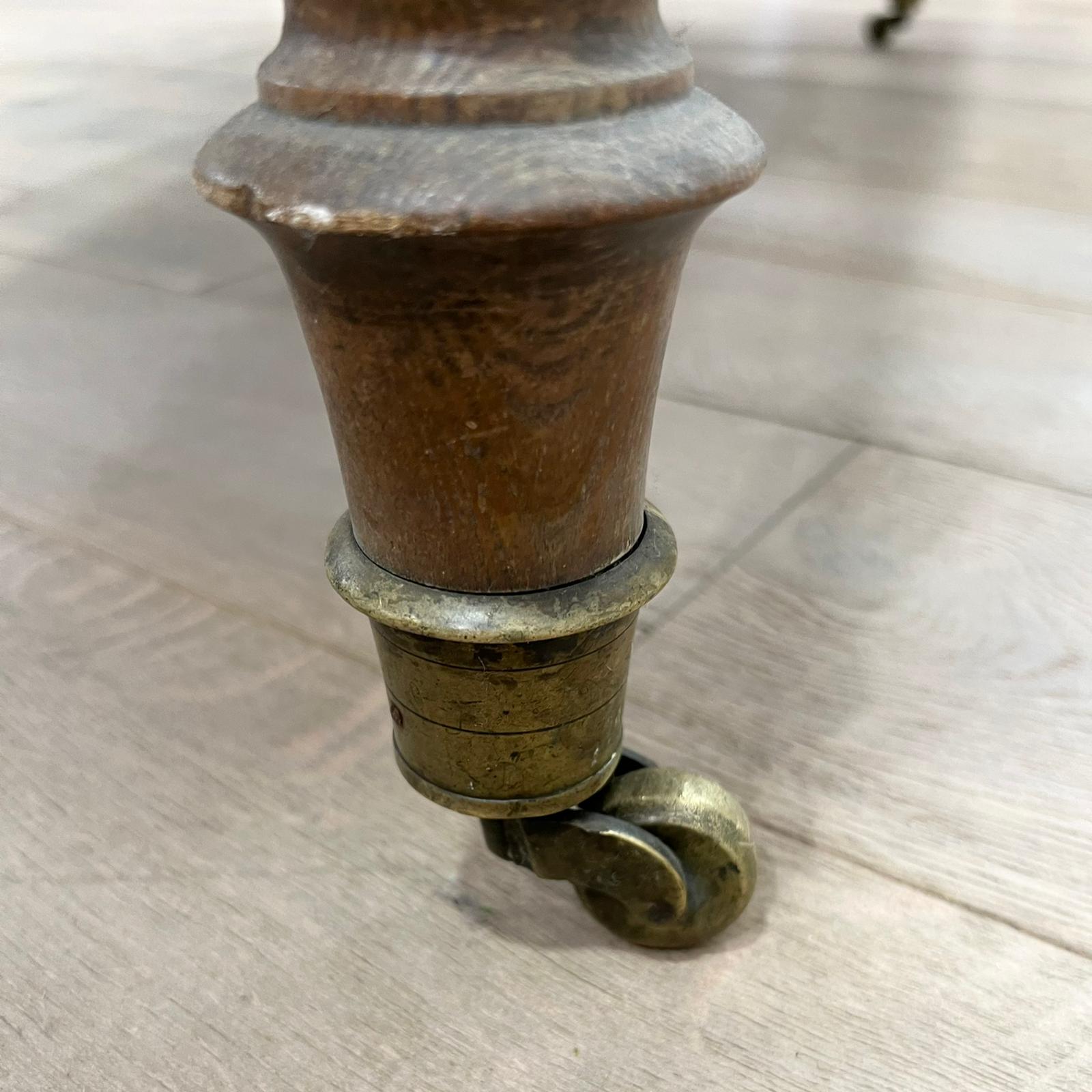 Louis Philippe wood dining table with shutters and casters